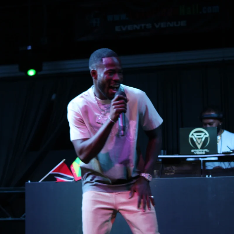 Learn how to master challenging low-light, high-contrast event photography. Real-world case study for junior and aspiring photographers.