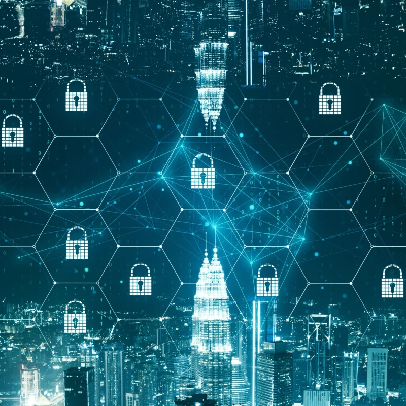 A futuristic blue digital city skyline overlay with cybersecurity padlock icons and honeycomb network nodes, representing Okurrrr.dev cybersecurity tracks for Black tech professionals.